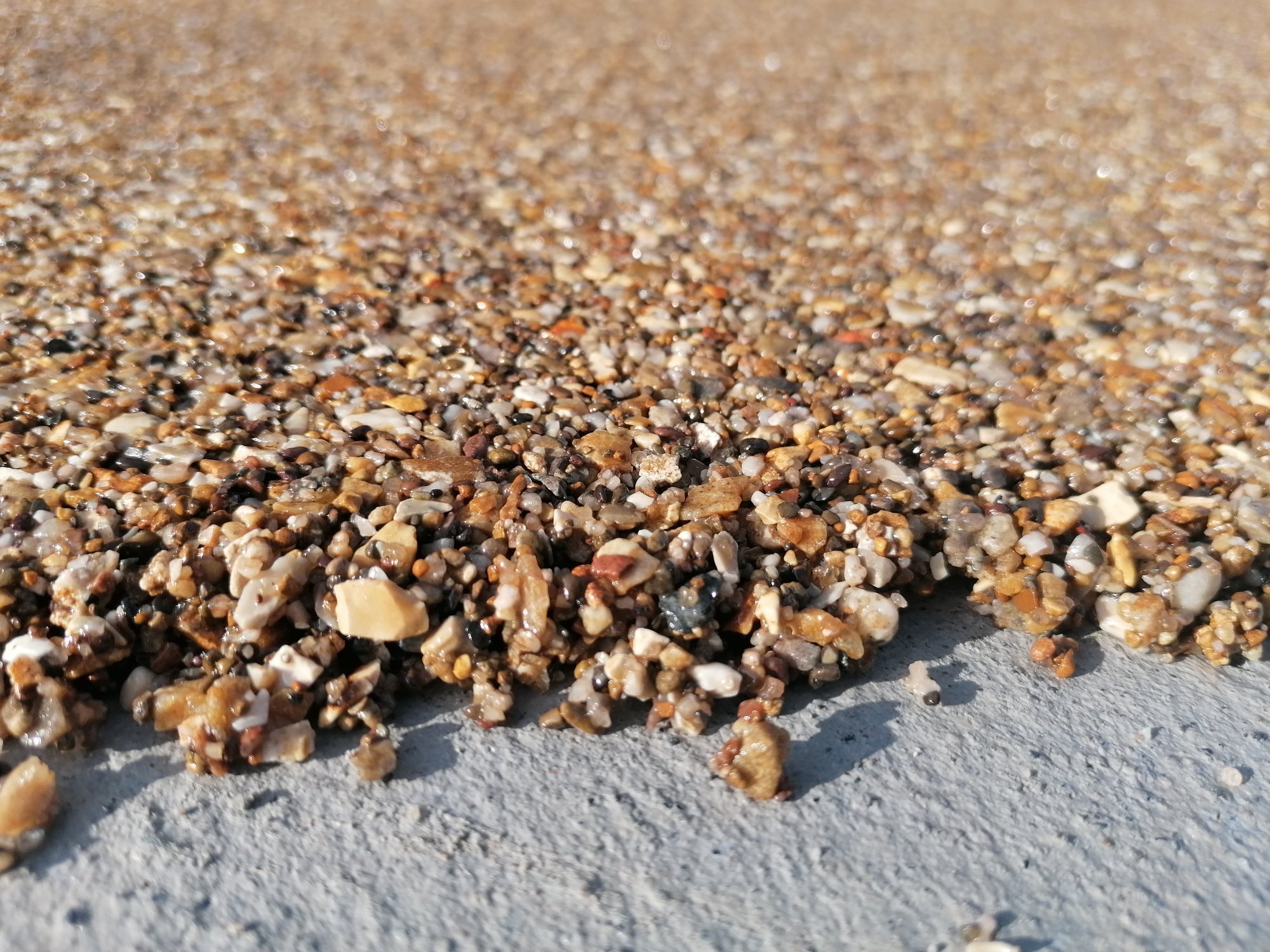 Kamenný koberec při renovaci starých ploch a kolem bazénu