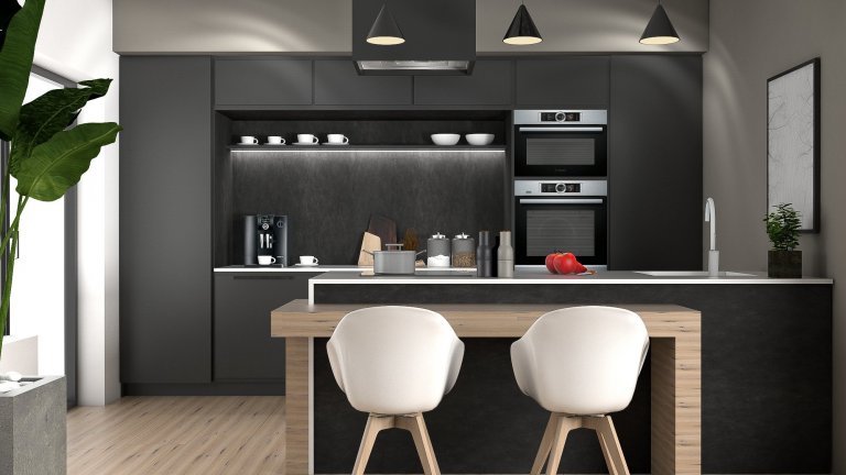 Ukázka naší práce designového návrhu kuchyňské linky s obývací částí. Dominantou prostoru je designová, minimalistická kuchyň. Vysoké zásuvné skříně nejen šetří místo, ale jsou i hezkým designovým prvkem nadčasové kuchyně. Vybavení je s veškerým komfortem. Za zásuvnými dveřmi, za kterými můžete nechat vše zmizet se nachází kuchyňské spotřebiče, úložné prostory pro potraviny, pracovní plocha, příprava pro volně stojící kávovar a mnoho prostoru se zásuvkami pro vybavení kuchyně. Při otevření dveří se otevře pohled na to, co je za nimi skryto: dokonale zorganizovaná kuchyně, kde vše, má své místo. Součástí pracovní desky je dřez z Corianu. Ponechali jsme zde dostatek pracovní plochy a své místo má i indukční deska. Barový stoleček, který je také součástí kuchyňského ostrůvku jsme navrhli ve vhodné výšce pro umístění klasických, pohodlných jídelních židlí.
